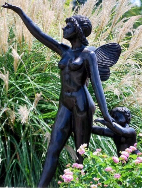 Fairy presenting Cherub to the forest garden statue female nude
